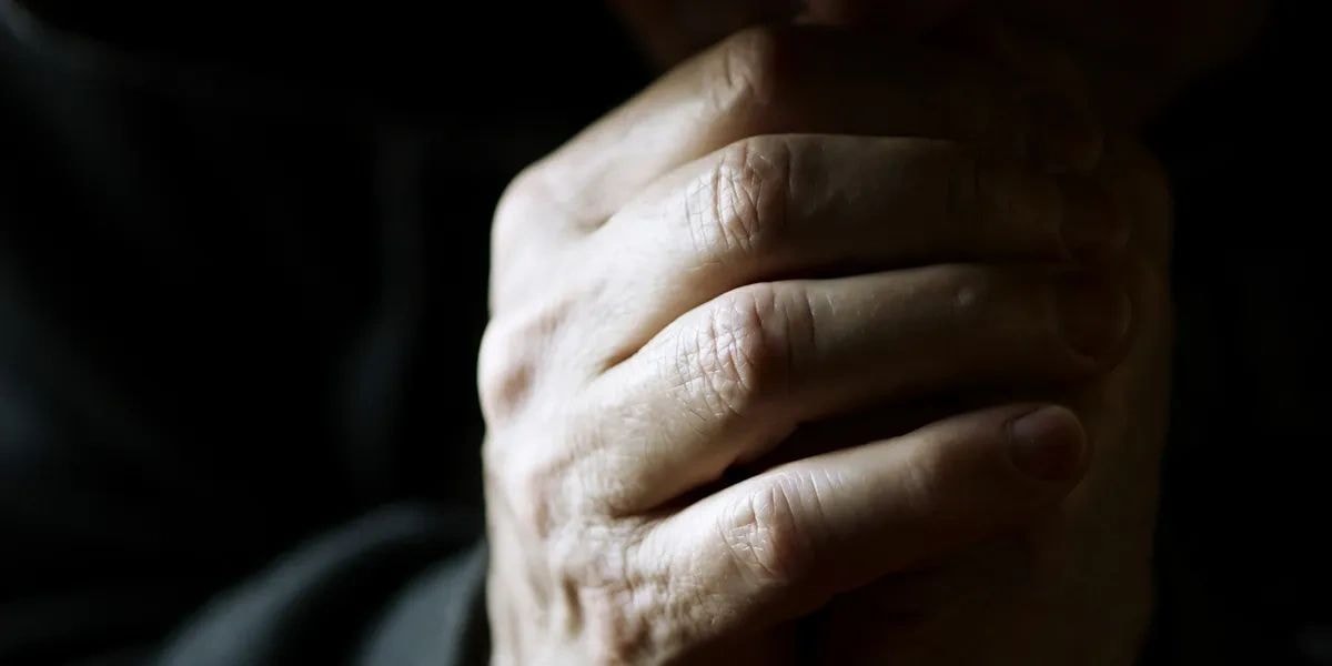 Hands folded in prayer